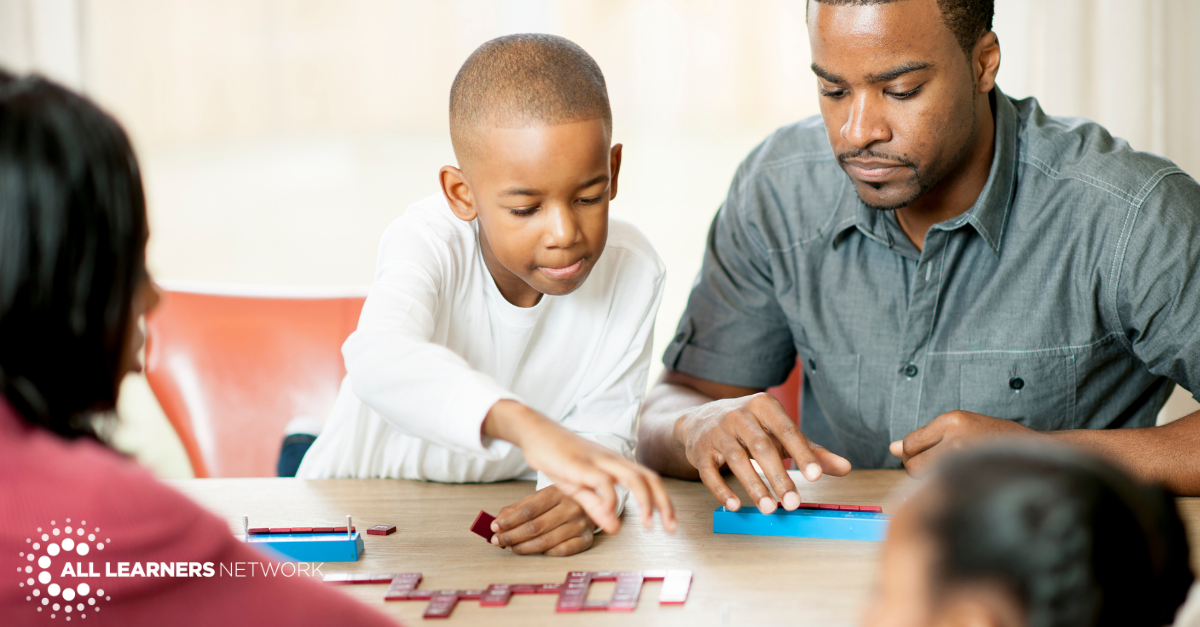 Family playing dominoes